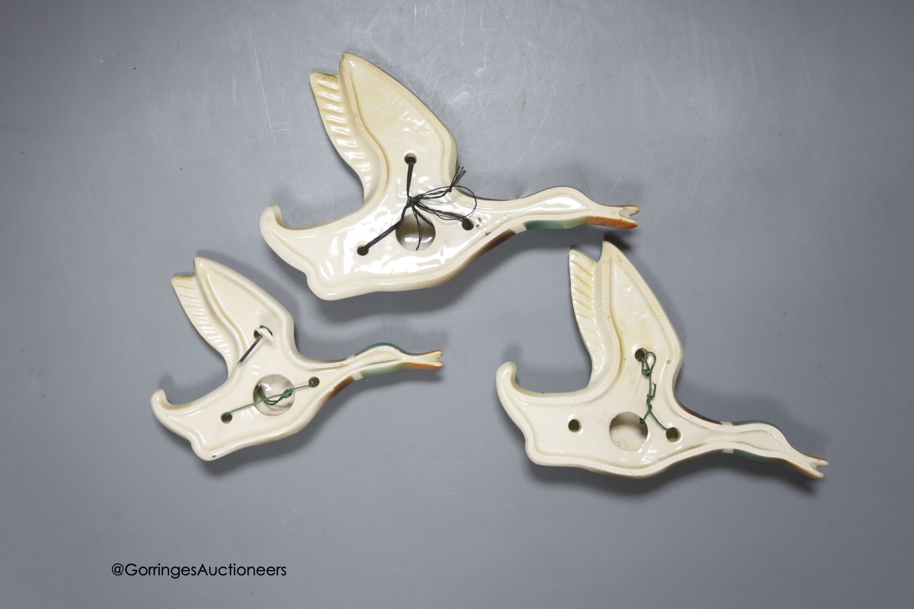 Three graduated pottery flying ducks, by Keele Street Potteries